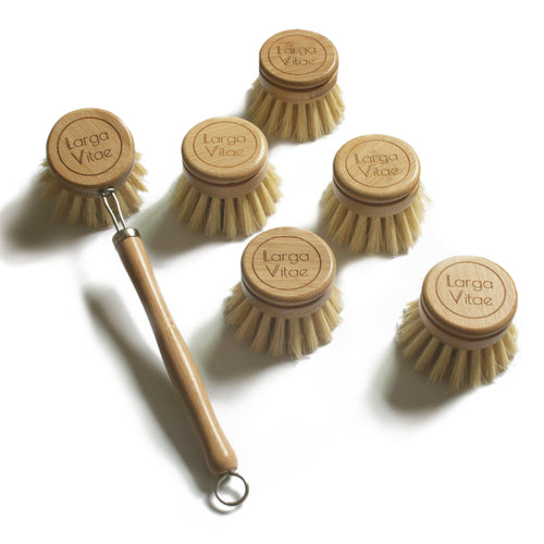 Set of Larga Vitae bamboo dish brushes with 1 whole brush and 5 replacement heads on a white background