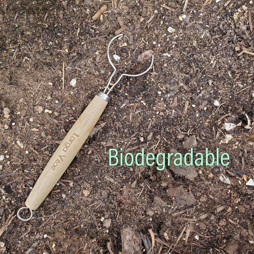 thick biodegradable bamboo dish brush wooden handle on soil