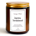 Amber glass Larga Vitae Jasmine, Sandalwood candle jar with gold lid designed in California on a white background